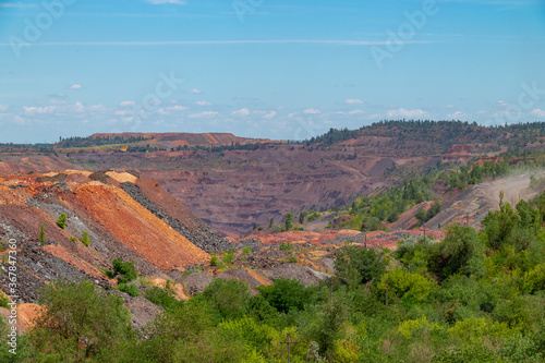 Ukraine, Krivoy Rog, unique place called "Ukrainian Mars". Waste rocks create multicolored mosaic. Open mine site with rare earth materials.