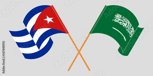 Crossed and waving flags of Cuba and the Kingdom of Saudi Arabia