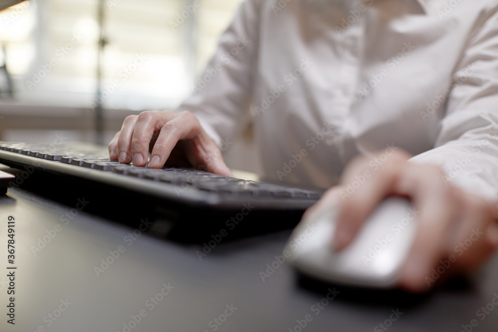 close up of businesswoman using computer mouse close up of businesswoman using computer mouse