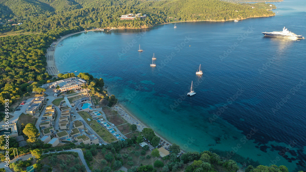 Fototapeta premium Aerial drone photo of beautiful popular organised sandy bay, turquoise beach and natural preserve lake with pine trees of Koukounaries, Skiathos island, Sporades, Greece