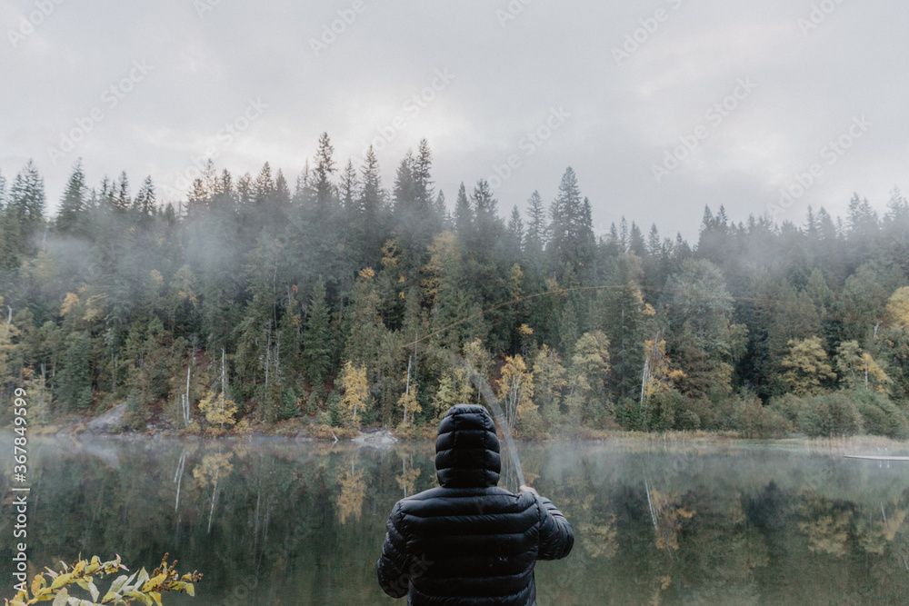 Obraz premium man fishing at lake