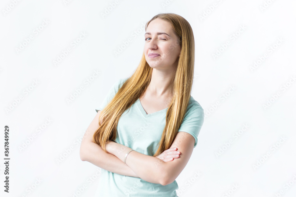 Portrait of a girl who smiles and winks an eye on a white background Portrait of a girl who smiles and winks an eye on a white background