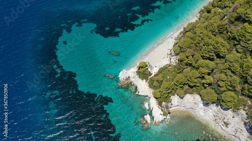 Aerial drone panoramic photo of famous turquoise paradise beach of Hovolo covered with pine trees, Skopelos island, Sporades, Greece photo