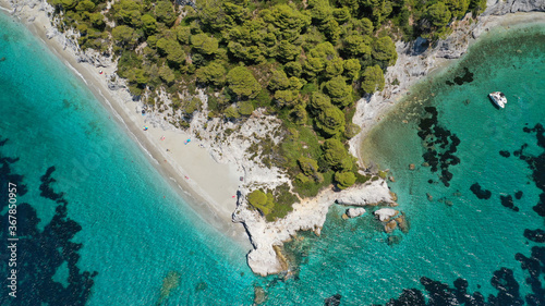 Aerial drone panoramic photo of famous turquoise paradise beach of Hovolo covered with pine trees, Skopelos island, Sporades, Greece photo