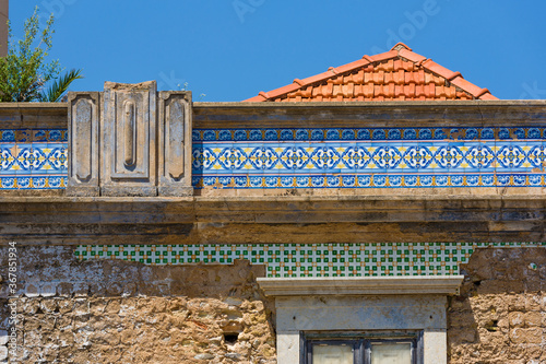Azulejos frieze on a facade of the old town of Faro, Algarve, Portugal