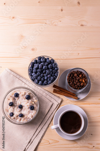 blueberries and porridge as morning healthy breakfast concept