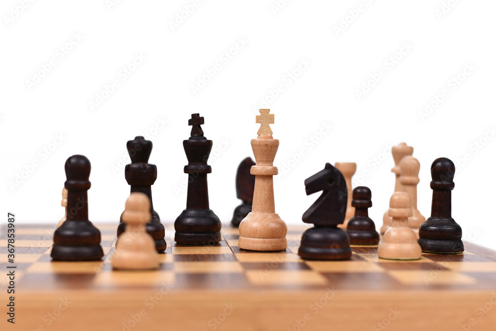 Chess board game with focus on white queen pieces on white background Chess board game with focus on white queen pieces on white background