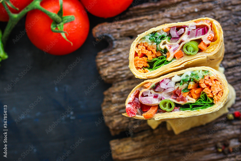 tortilla burrito wrap stuffing vegetables lavash vegetarian pita bread Menu concept Takeaway serving size fast food background top view copy space tortilla burrito wrap stuffing vegetables lavash vegetarian pita bread Menu concept Takeaway serving size fast food background top view copy space