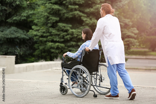 Doctor and young woman in w...