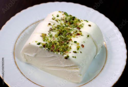 Milk ice cream. Handmade ice cream with pistachio nuts. Maras ice cream. (Maras Dondurmasi)
