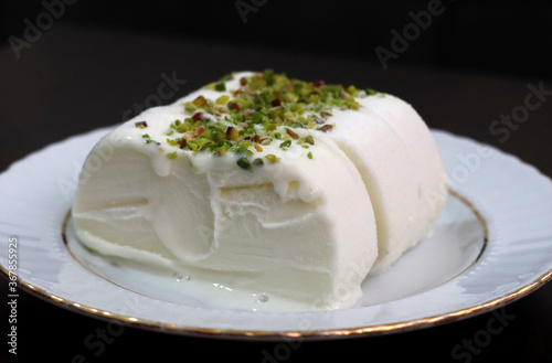 Milk ice cream. Handmade ice cream with pistachio nuts. Maras ice cream. (Maras Dondurmasi)