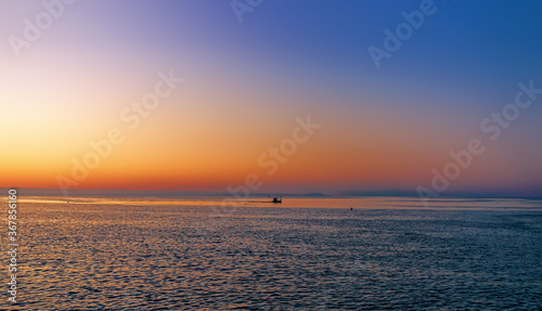 Fishing boat at sunrise.