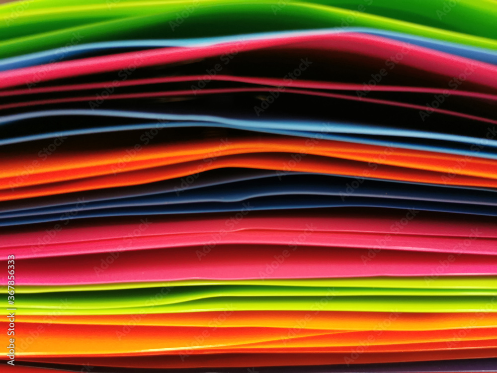 Close Up Multicolored Plastic File Folders Background
