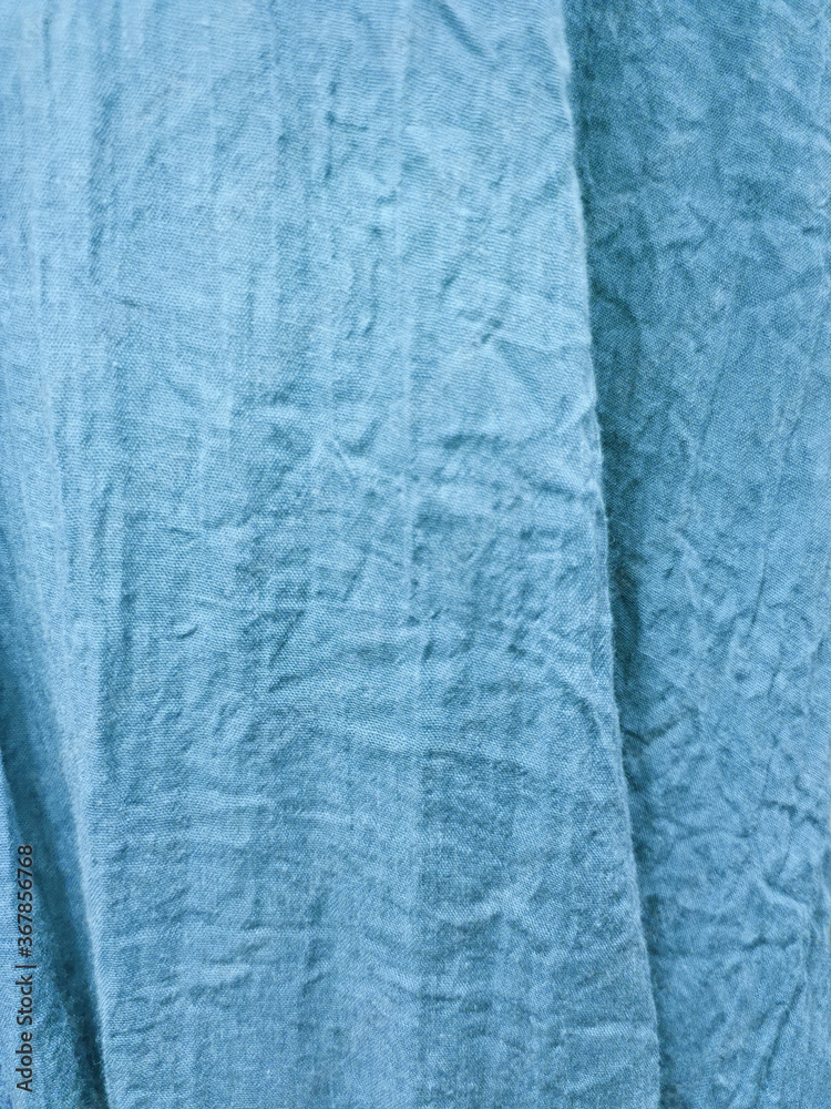 crumpled blue fabric background with selective focus crumpled blue fabric background with selective focus