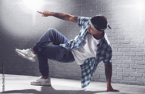 Male hip-hop dancer in studio photo