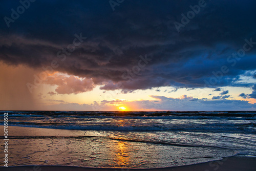 Sunset view over the sea. Beautiful sunset over the sea. View of the beach, sea and sunset.