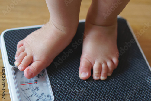 feet on scale showing obesity