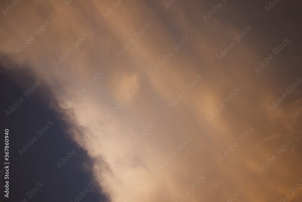 Fototapeta premium Evening clouds against the blue sky