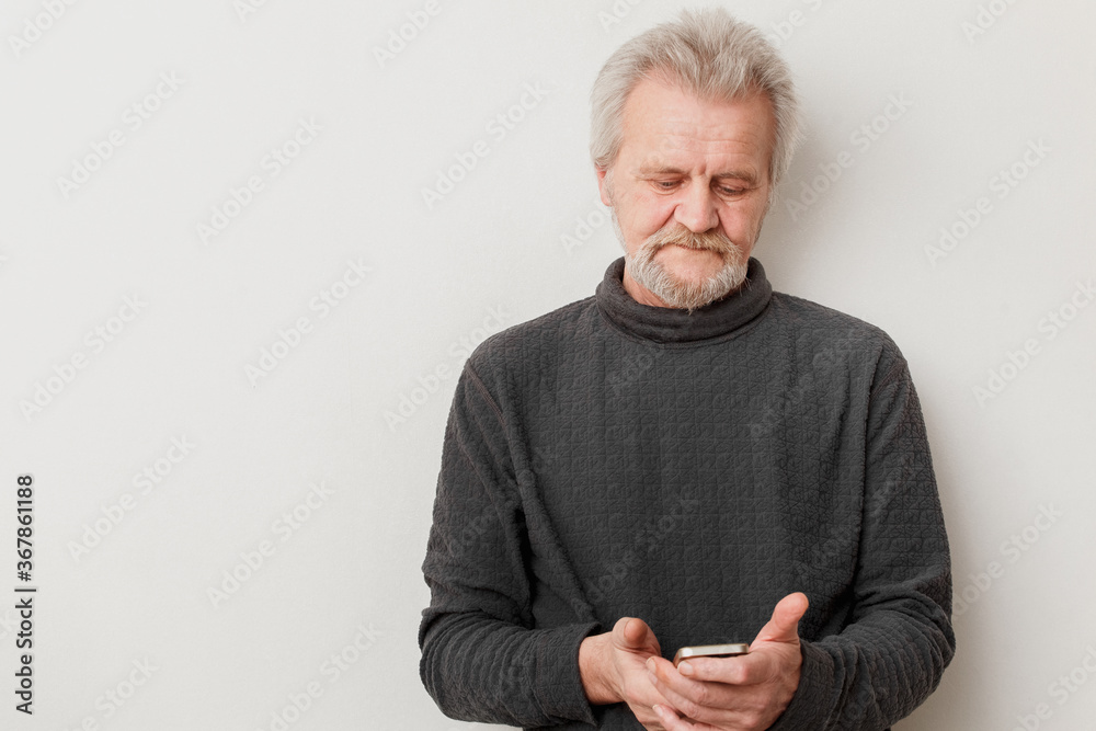 senior man with mobile phone on a white background senior man with mobile phone on a white background