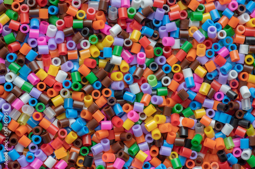 multi-colored plastic beads, small pieces of plastic mosaic, background for children's creativity, the development of fine motor skills