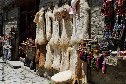 Lahic. A display of traditional Azeri souvenir hats, bags and sheepskin furs on the Main Street of Lahic, a highland village in Azerbaijan. photo