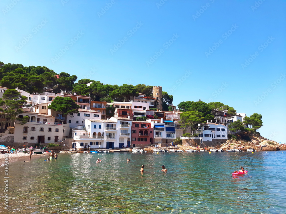 26.07.2020: Sa Tuna, Begur, Costa Brava, Spain. Colorful houses in sea bay with beach in coastal mediterranean village.