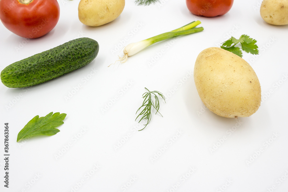 Fresh vegetables on a white background, flat lay: Potatoes, green onions, dill, tomato, parsley. Healthy food, vegan food. Fresh vegetables on a white background, flat lay: Potatoes, green onions, dill, tomato, parsley. Healthy food, vegan food.