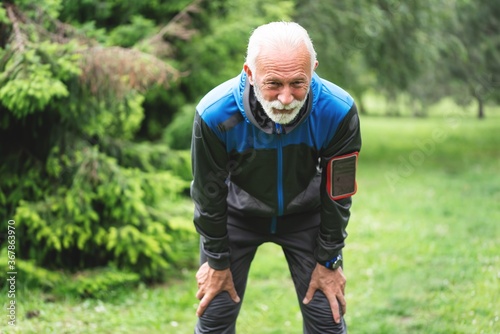 Tired man resting after jogging at park © focusandblur