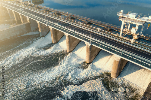 Hydroelectricity power station gates with flowing water, aerial view. photo