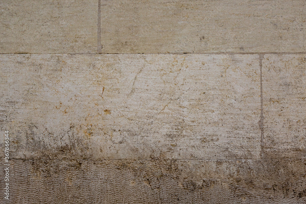 Obraz premium Gray colored lime stone wall texture. Brushed blocks with flat cuts.