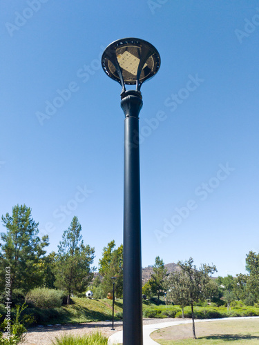 A power saving LED sidewalk lamp at a park