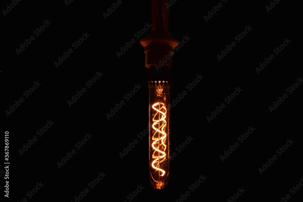 Tube shaped LED light bulb on a black background. Tube shaped LED light bulb on a black background.