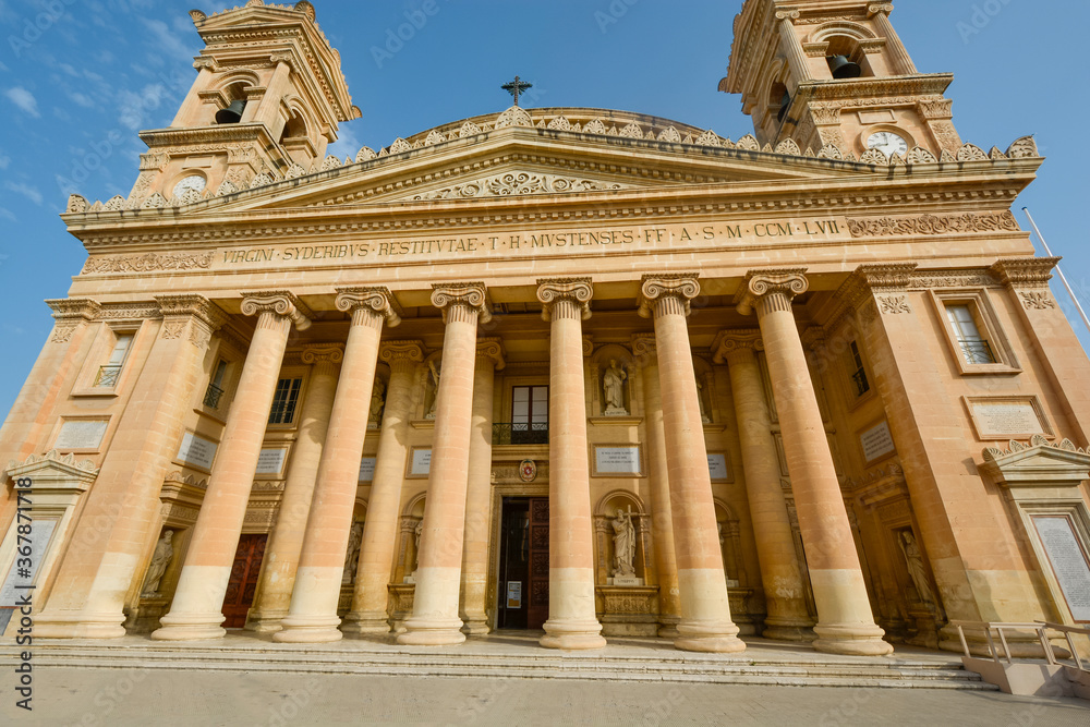 Naklejka premium The front facade and entrance to the Mosta Rotunda or Basilica of the Assumption of Our Lady in Mosta, Malta.
