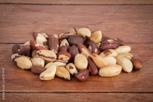 Brazilian nut, known as "Castanha do Pará". Wood background.