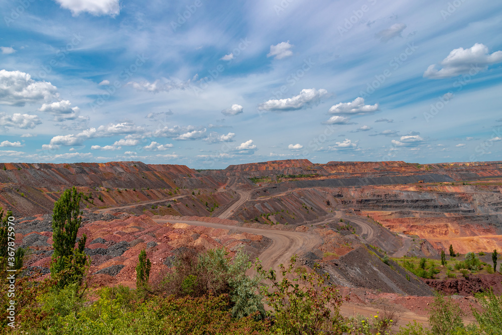 Ukraine, Krivoy Rog, the 16 of July 2020. Unique mine site with multi colored fossil fuels situated within city limits.
