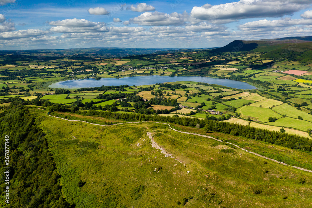 Aerial view of an old hillfort and lake