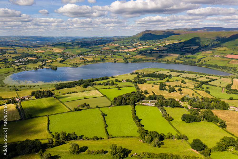 Aerial view of a lake and farmland