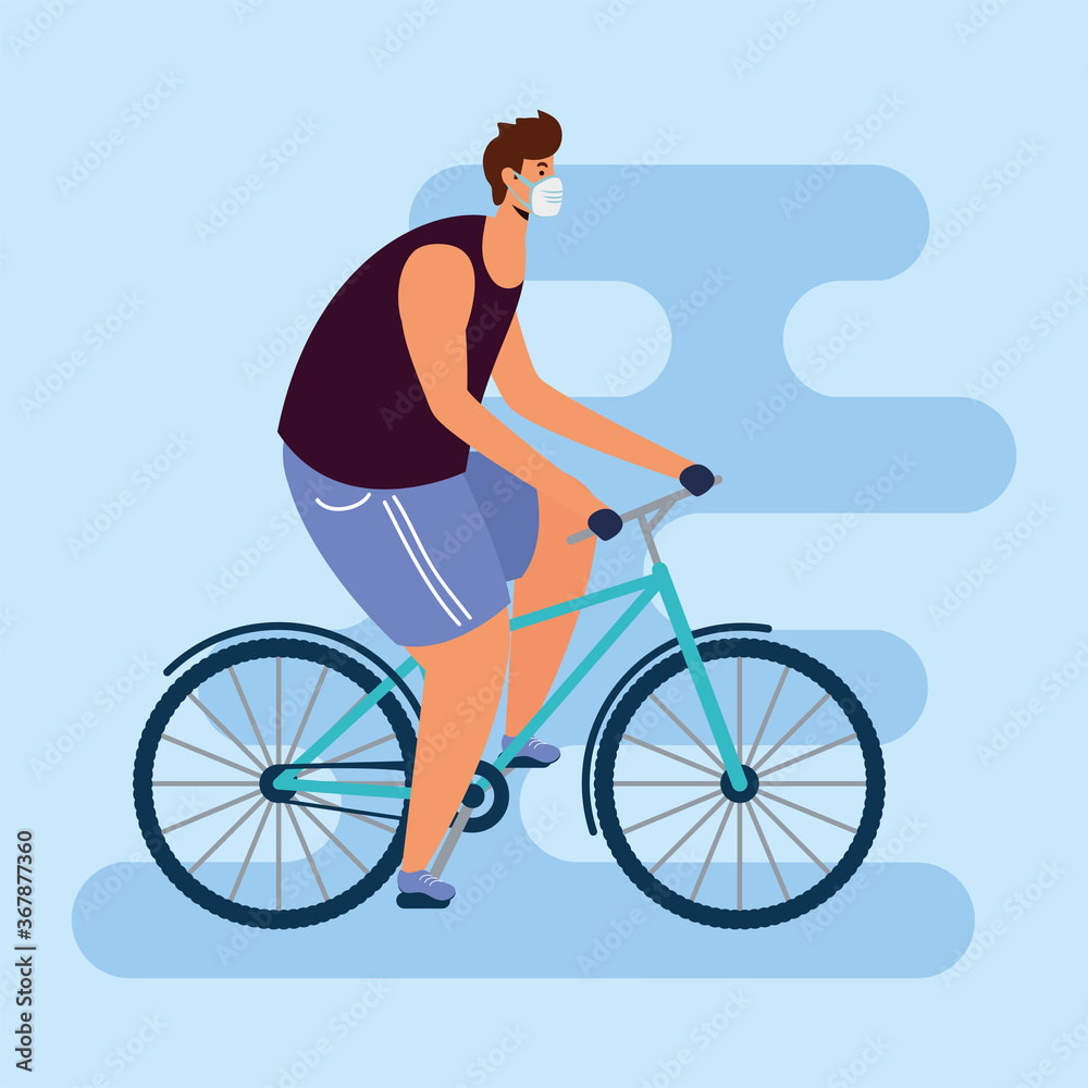 young man wearing medical mask in bicycle young man wearing medical mask in bicycle
