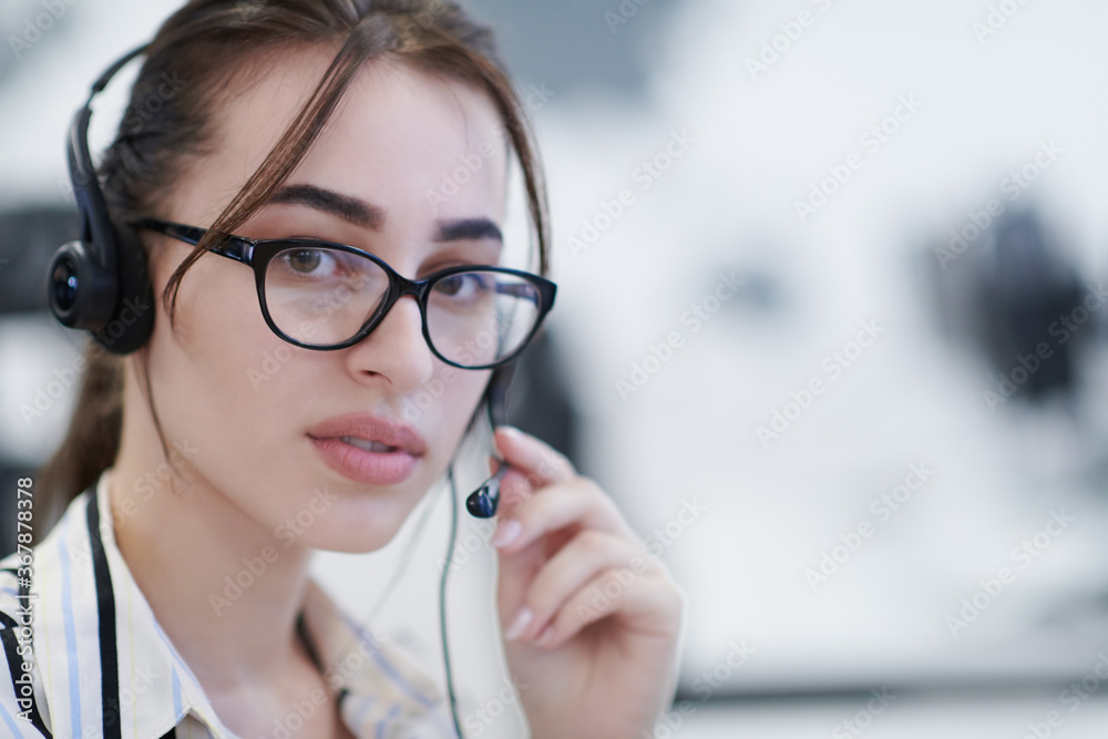 Business woman with headsets at work