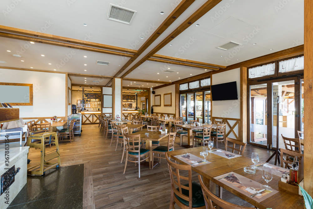 Interior of a hotel restaurant with wooden furniture