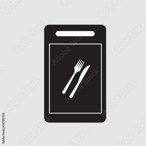 chopping board with fork and knife