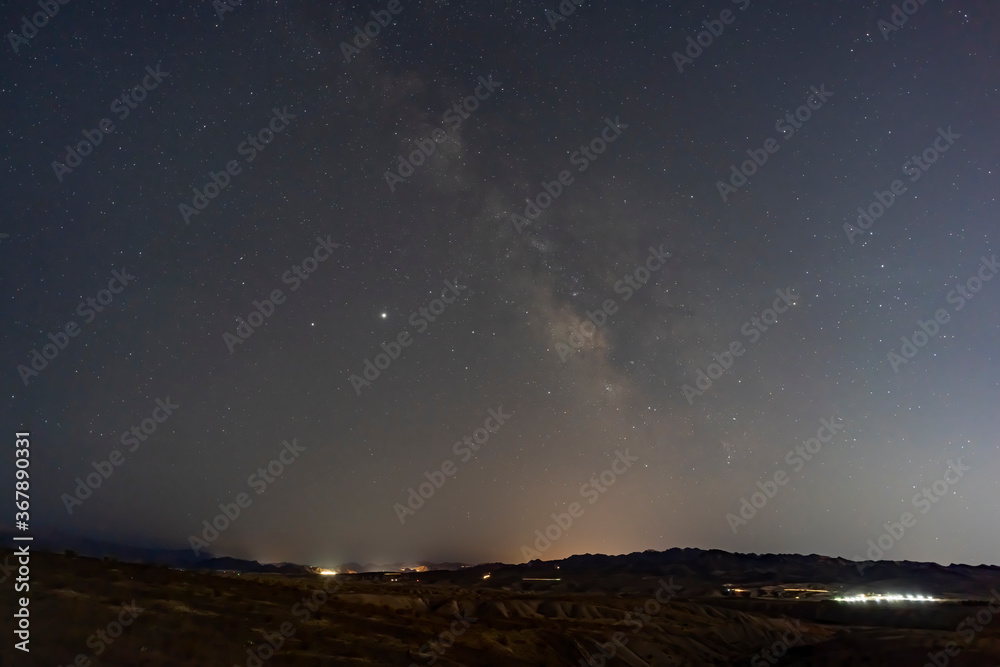 Night starry sky with a beautiful milk way over Lake Mead