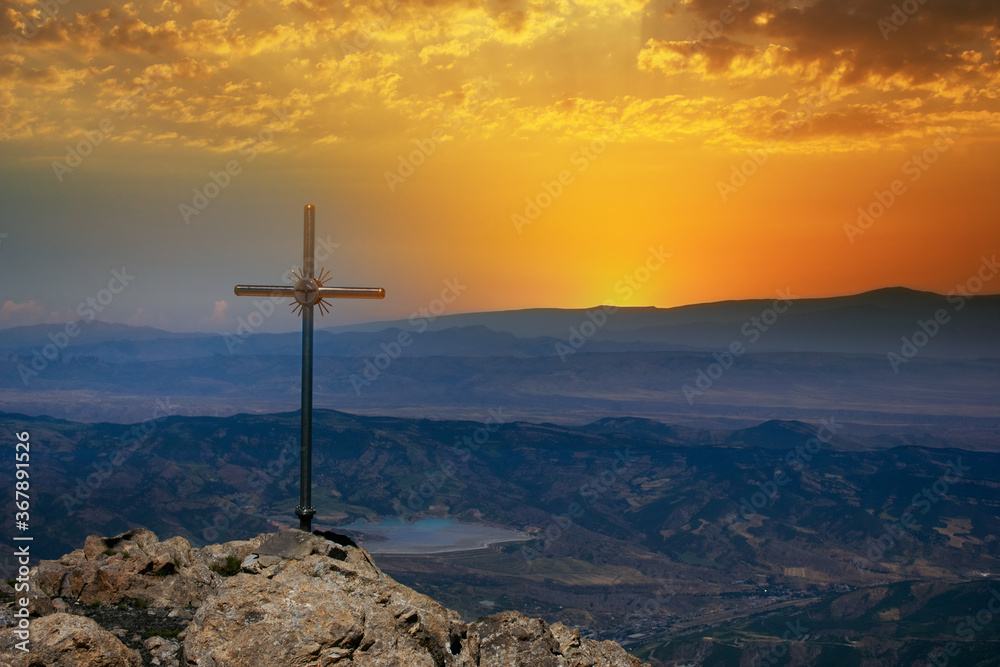 cross on top of a mountain