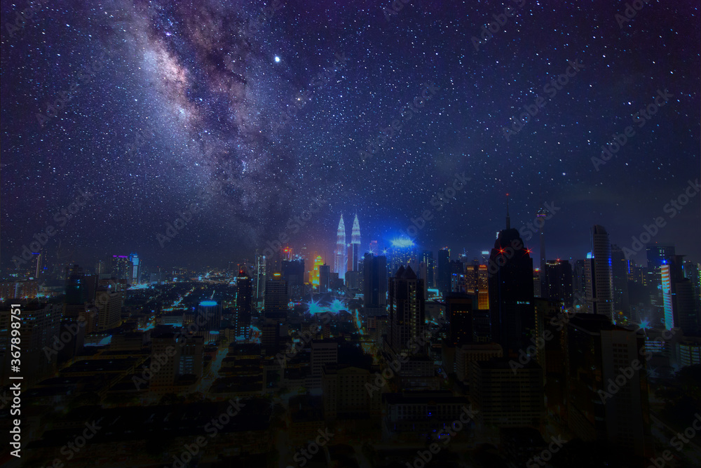Obraz premium Milky Way Galaxy rising in Kuala Lumpur City. Image contain Noise and Grain due to High ISO. Image also contain soft focus and blur due to Long Exposure and Wide Aperture.