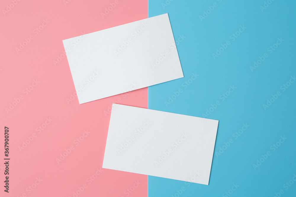 Business card  on pink and blue background