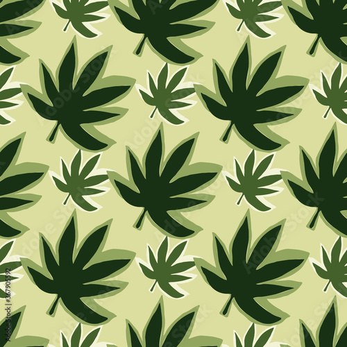 Seamless pattern with endless cannabis leaves on pastel yellow background.