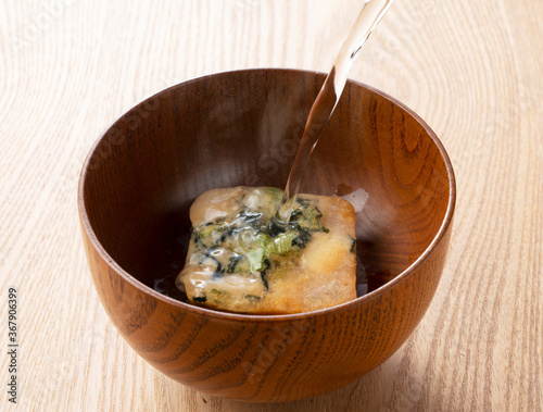 Pour hot water into freeze-dried miso soup.