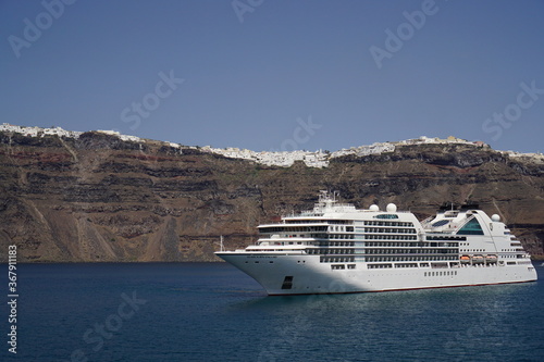 the town on the cliff and the ferry, Santorini island in Greece, Europe