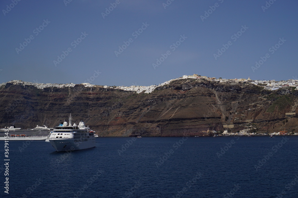 the town on the cliff and the ferry, Santorini island in Greece, Europe