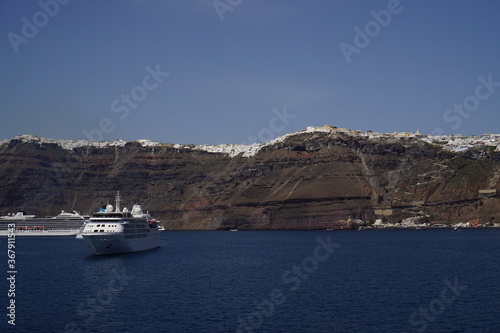 the town on the cliff and the ferry, Santorini island in Greece, Europe